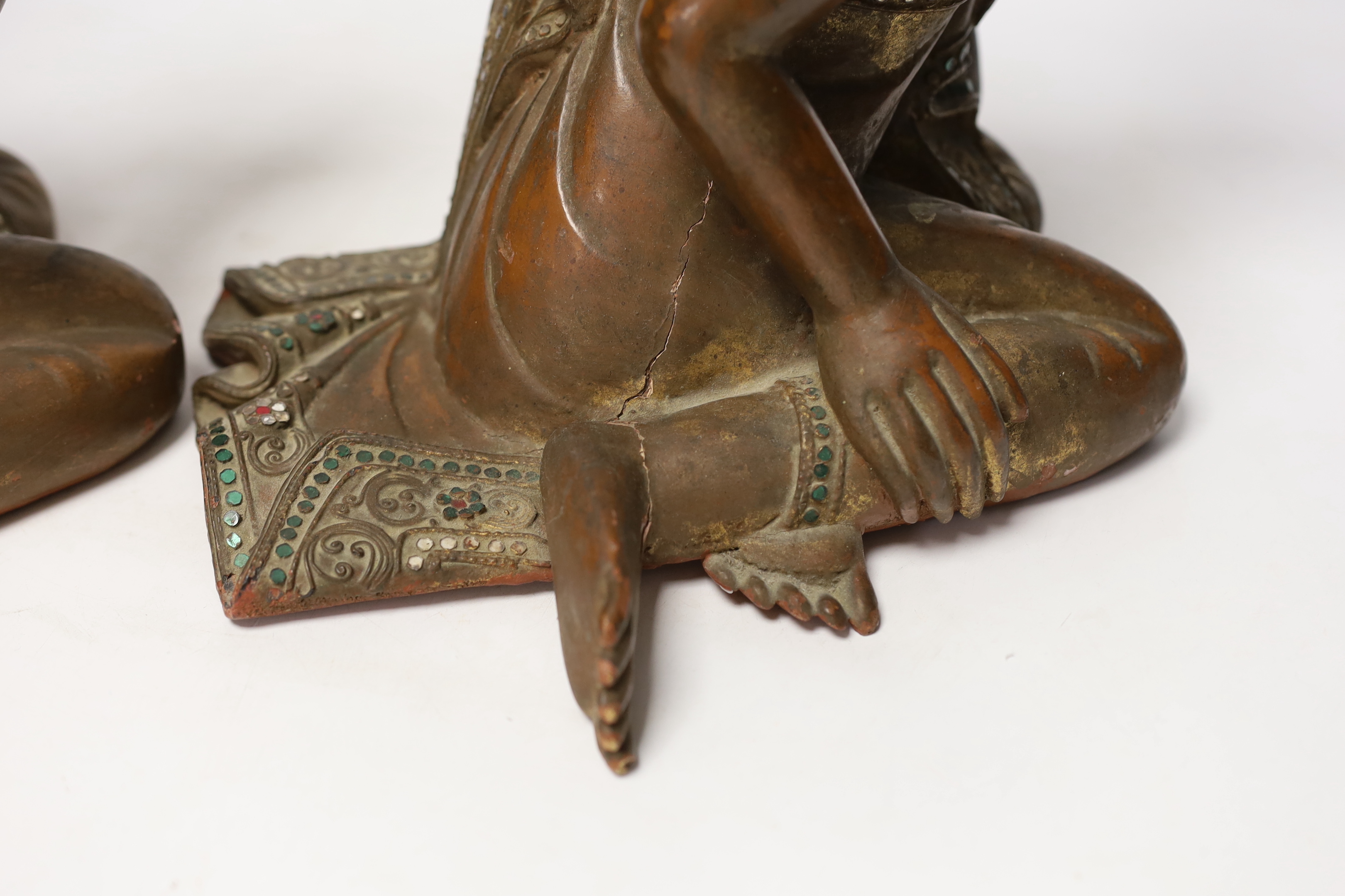 Two papier-mâché and lacquer Thai praying monks, 29.5cm high